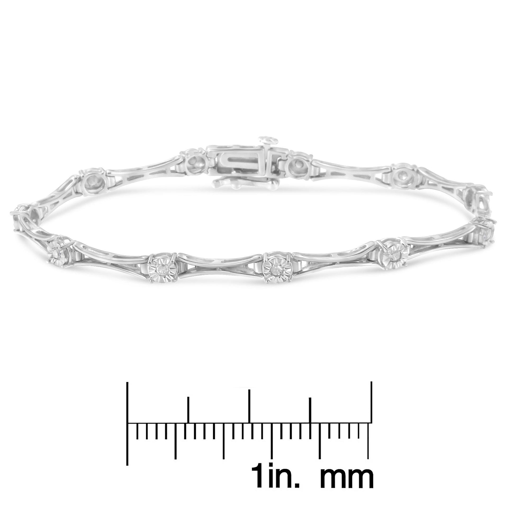 White metal bracelet with round white gemstones in miracle settings, displayed in a front-facing view, placed above a ruler for size reference.