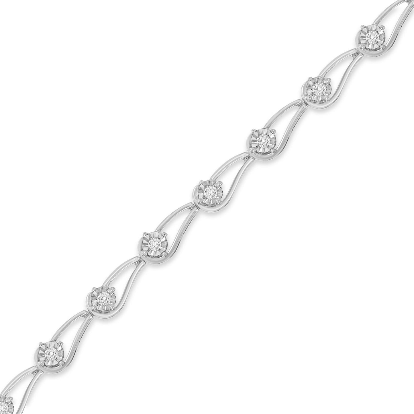 Diagonal close-up of a white bracelet featuring round white gemstones in a miracle setting connected by curved links.
