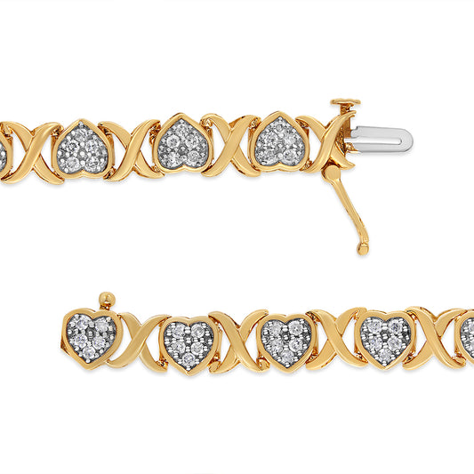 Close-up front view of a yellow and white bracelet featuring heart-shaped links with white gemstones in a pave setting alternating with X-shaped links.