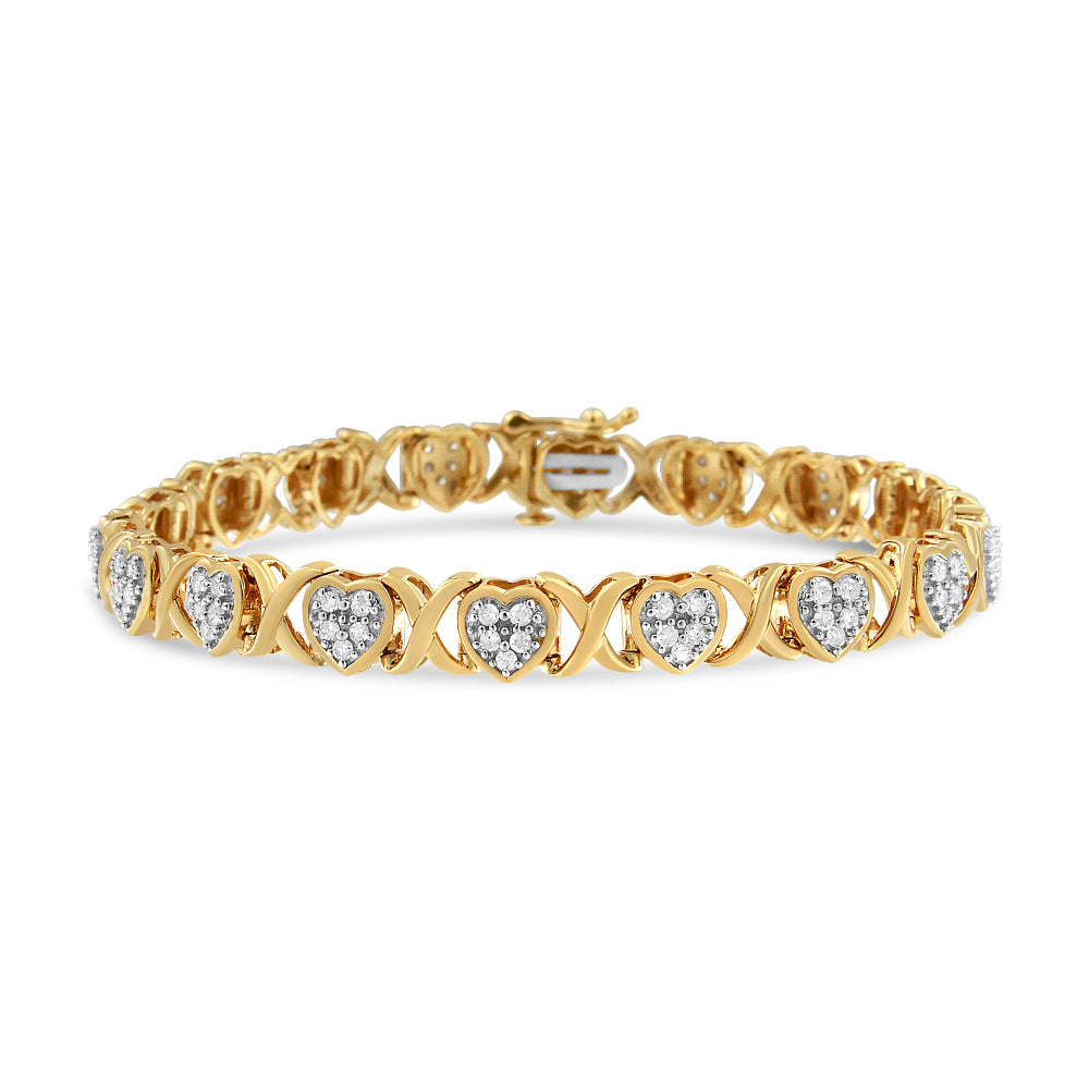 Yellow and white metal bracelet with heart-shaped links set with white gemstones in pave setting, front angle.
