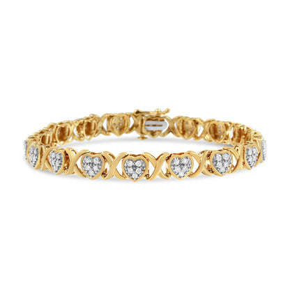Yellow and white metal bracelet with heart-shaped links set with white gemstones in pave setting, front angle.