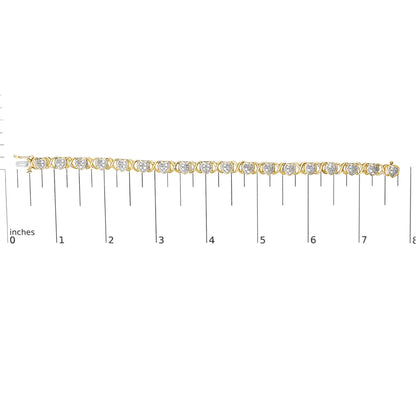 Bracelet with alternating yellow and white metal heart-shaped links with white gemstones in pave setting, displayed flat on a ruler for size reference, shot from above.