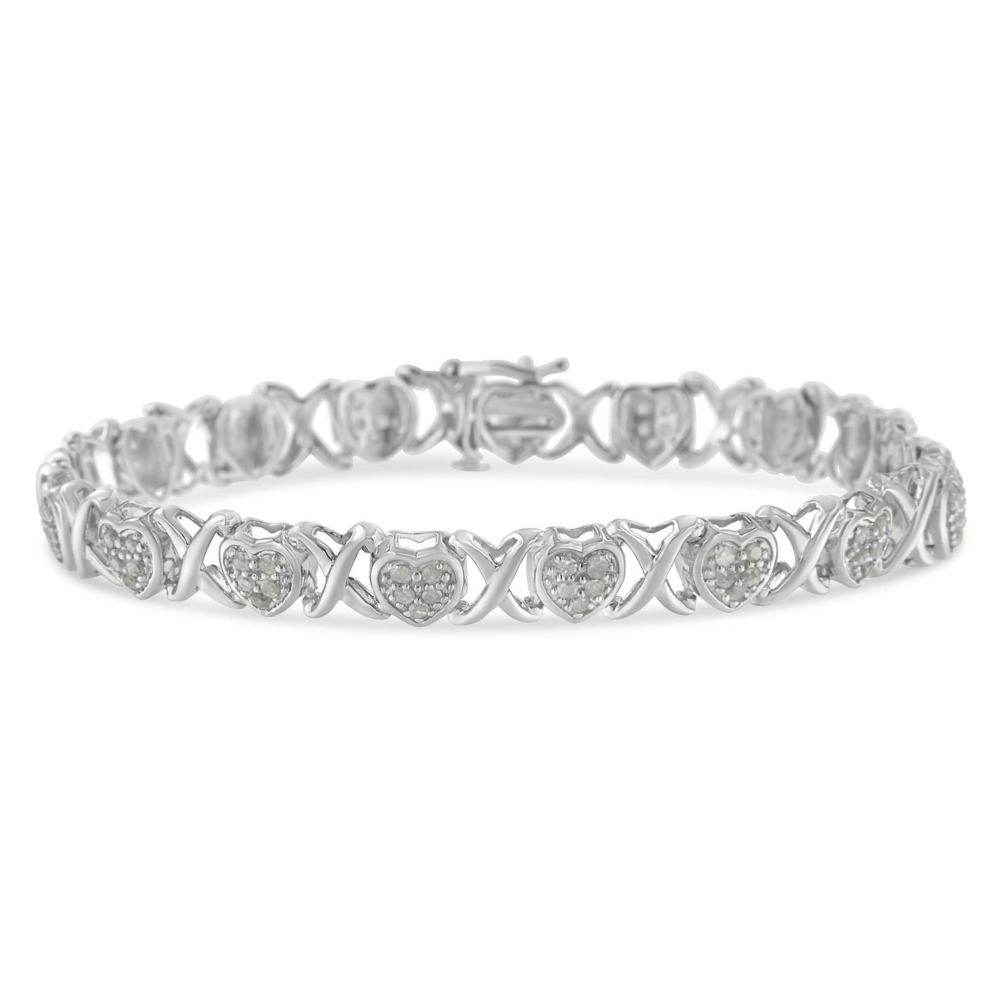 Front-facing shot of a white metal bracelet featuring alternating heart shapes with pave set round white gemstones and X-shaped links.