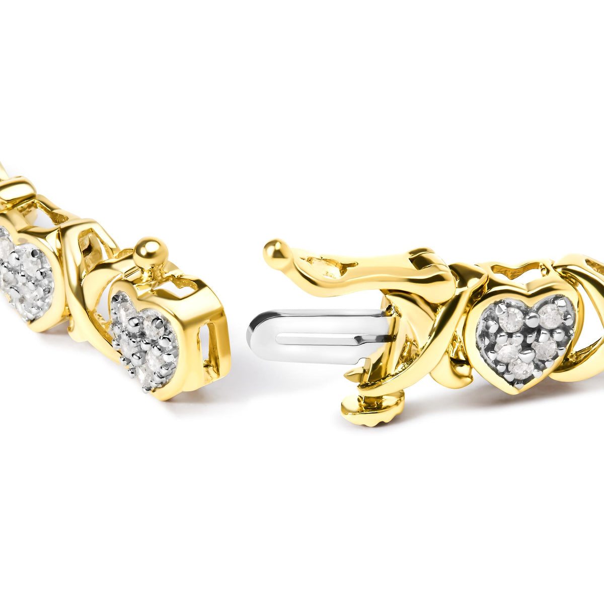 Close-up image of a yellow bracelet with heart-shaped links featuring white round gemstones in prong settings, shown at a slight angle focusing on the clasp area.