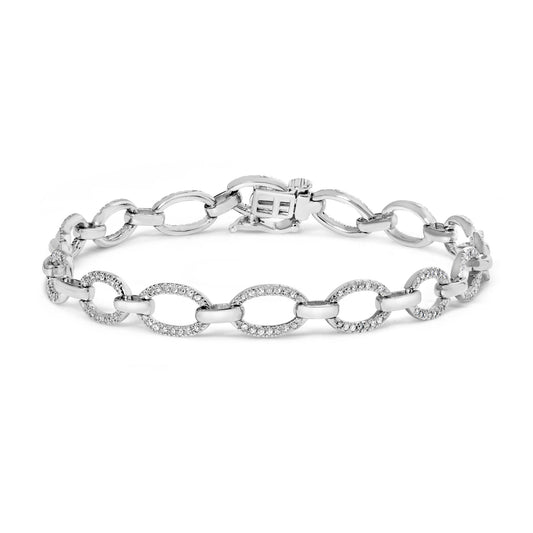 White metal bracelet with alternating plain and white gemstone-studded oval links, shown from a front angle.