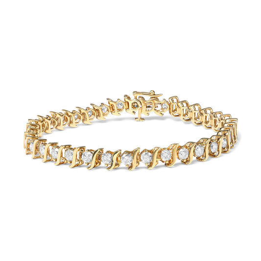 Yellow metal bracelet with round white gemstones in prong settings, shown from a slightly elevated side angle.