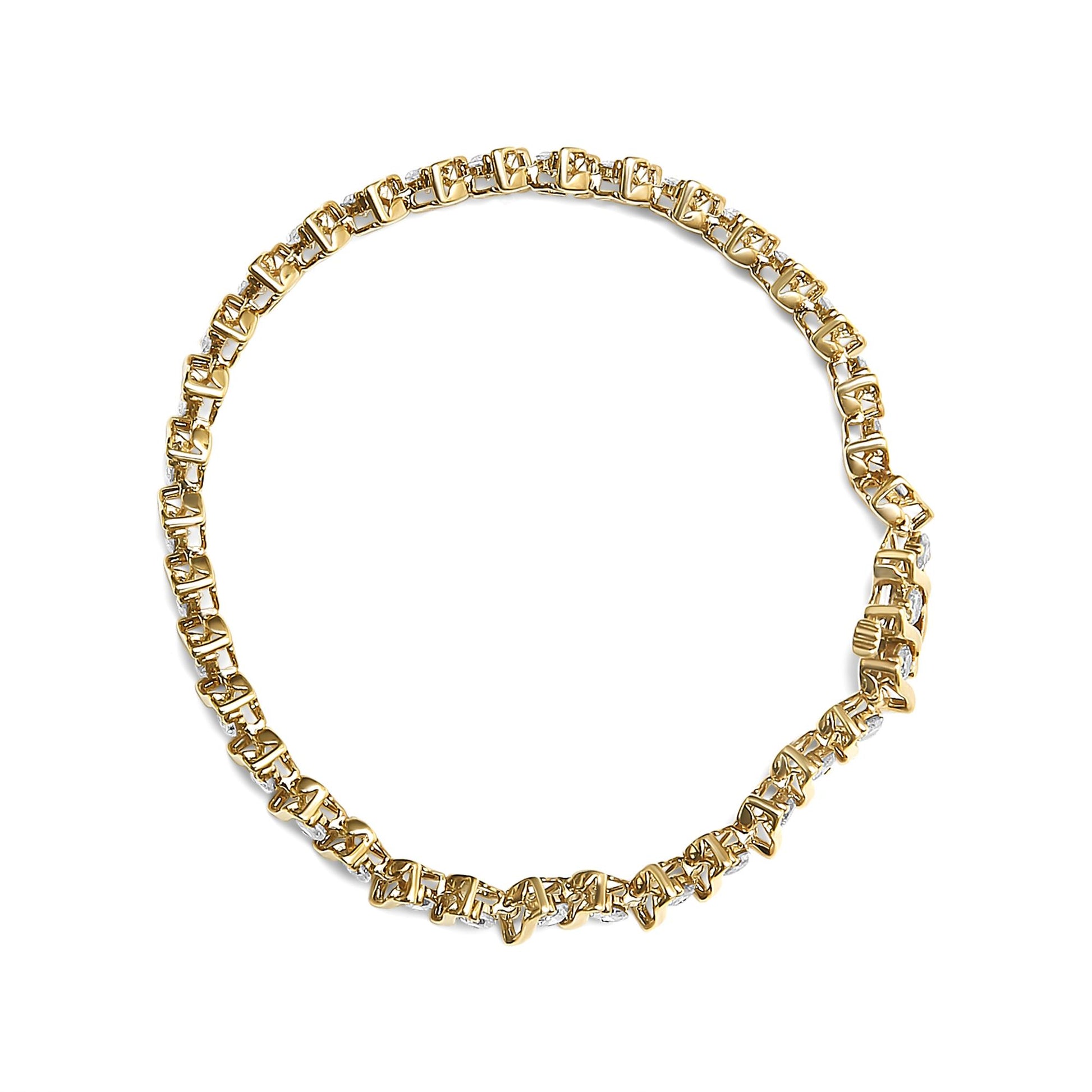Top-down view of a yellow metal bracelet with round prong-set brownish gemstones linked in a circular design.