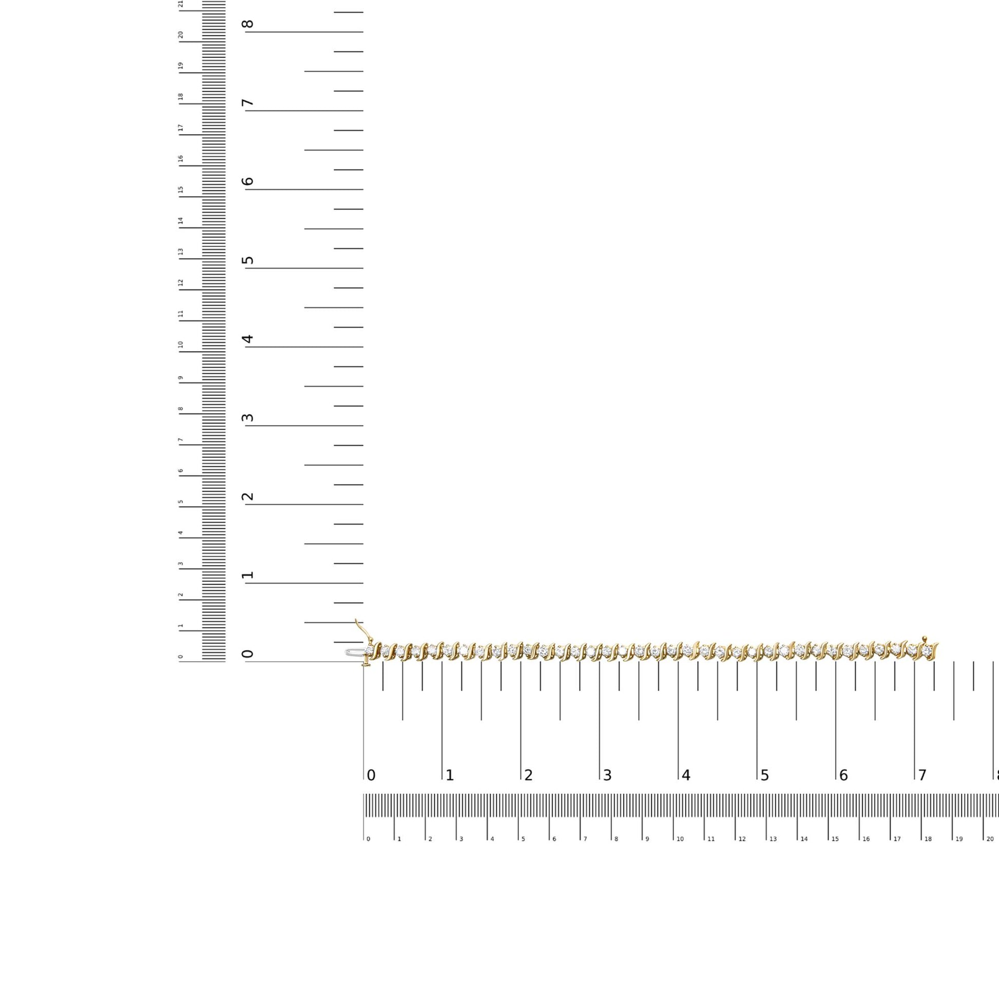 Yellow bracelet with prong-set round brownish gemstones, displayed on a ruler for size reference, shot from above.
