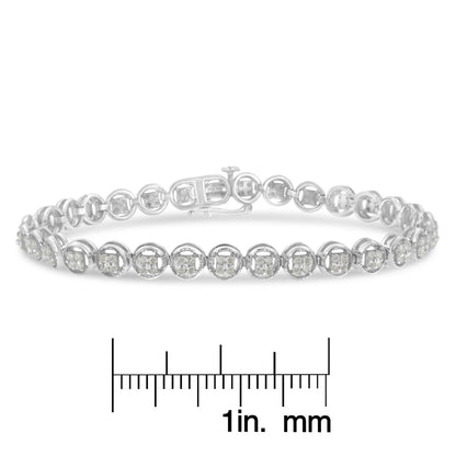 White metal bracelet with round white gemstones in prong setting, shown in a close-up front angle, placed above a ruler for size reference.