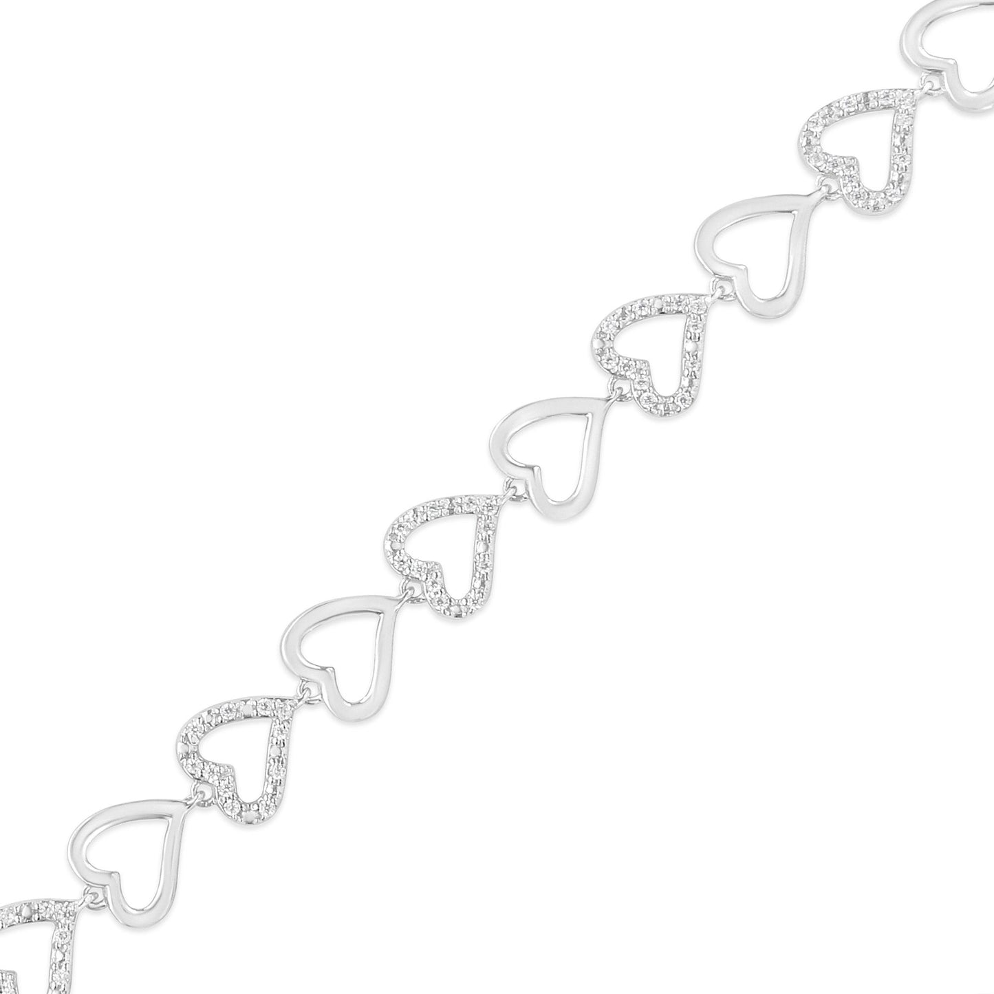 Diagonal close-up of a white metal bracelet with alternating open heart shapes and prong-set round white gemstones.