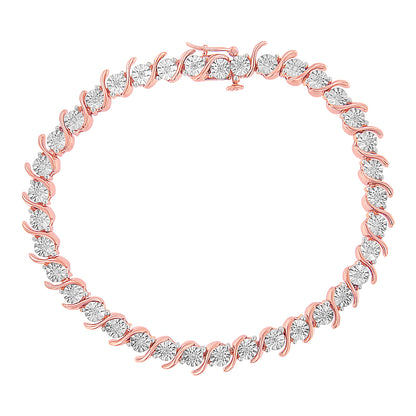 Rose metal bracelet with round white gemstones in a miracle setting, shown from a top-down angle.
