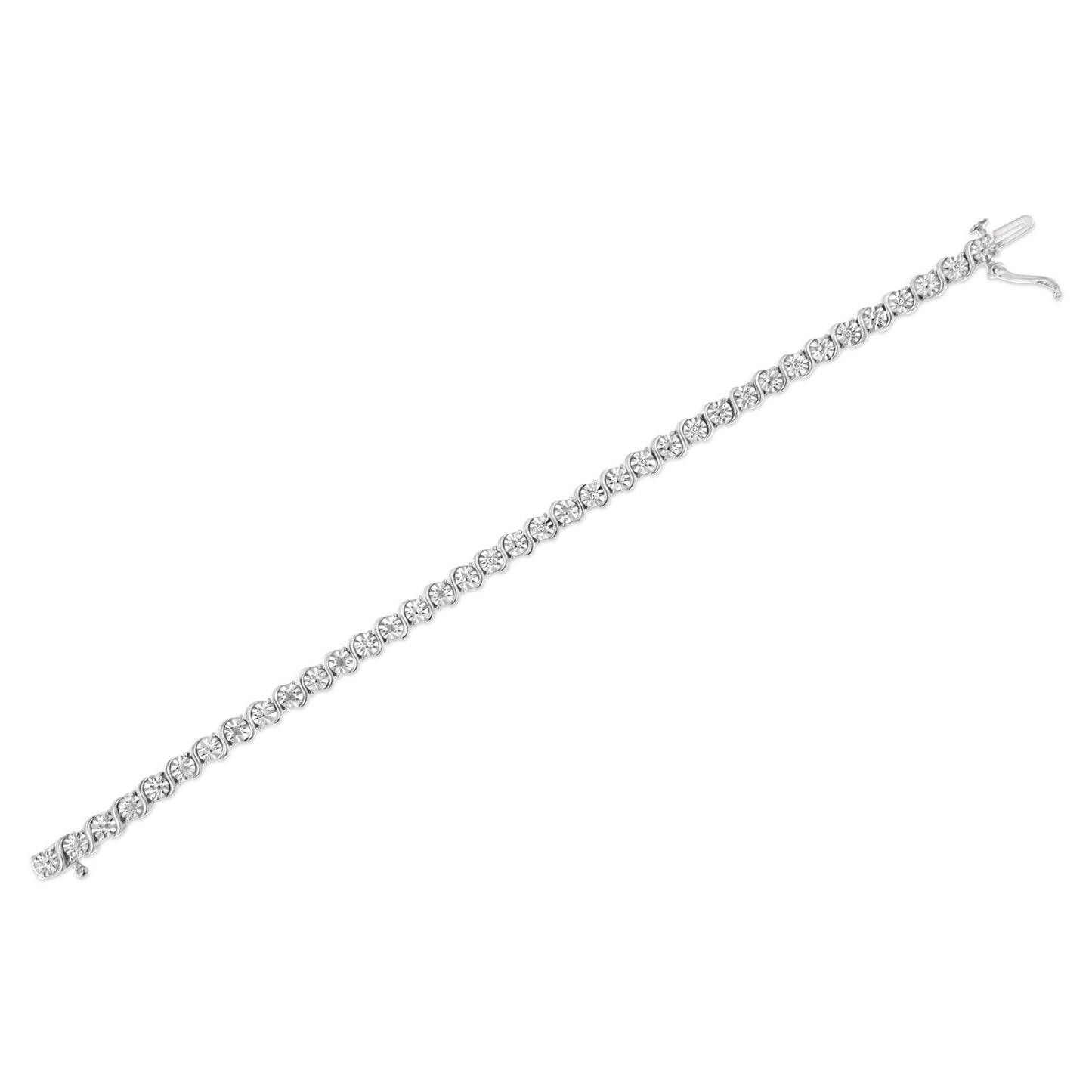 White metal bracelet with round white gemstones in a miracle setting, shown in a flat lay diagonal angle.