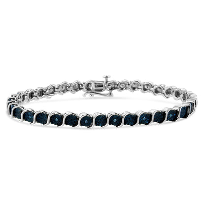 White bracelet with round blue gemstones in miracle settings, shown from a front angle on a white background.