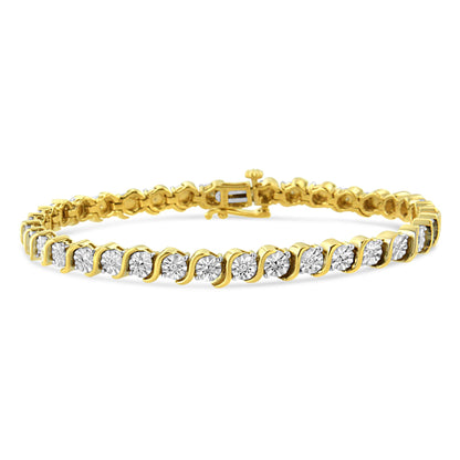 Bracelet viewed from a slight front angle featuring round white gemstones set in a yellow metal band with a wavy design between each stone.