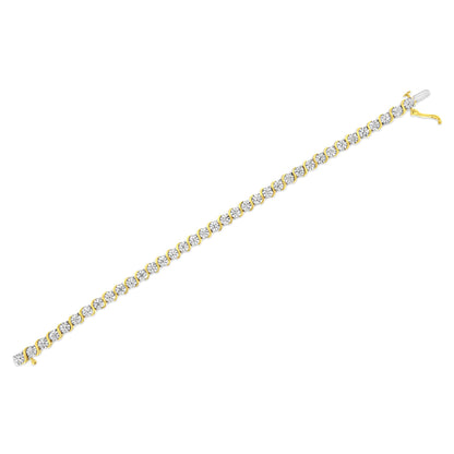 Yellow metal bracelet with round white gemstones in a miracle setting, shown flat at a slight diagonal angle on a white background.
