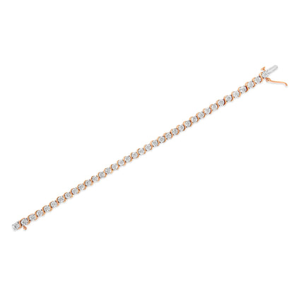 Rose-colored bracelet shown flat from a top-down angle, featuring round white gemstones set in a miracle setting along its length.