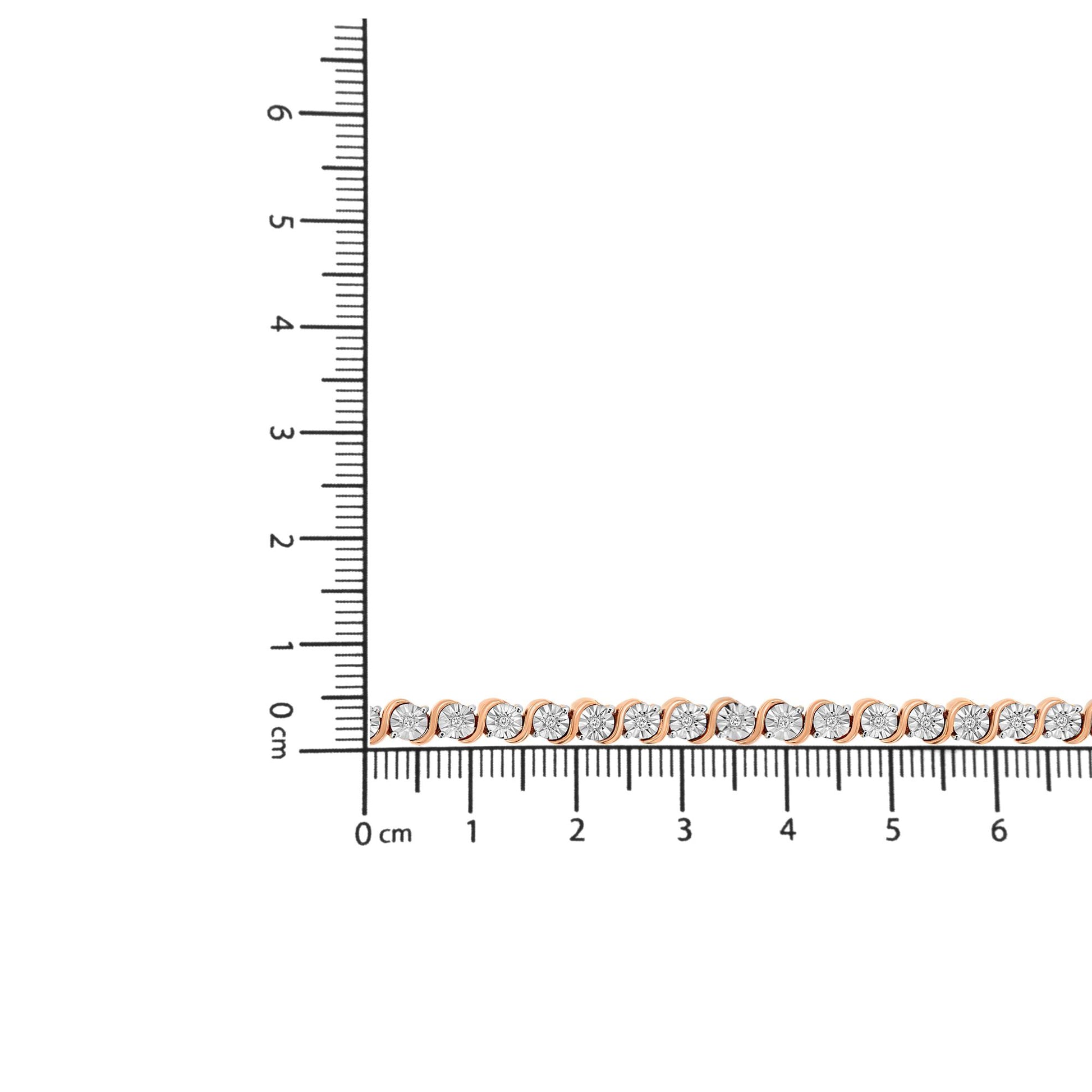 Rose metal bracelet with round white gemstones in a miracle setting, photographed on a ruler for size reference with a front-facing angle.