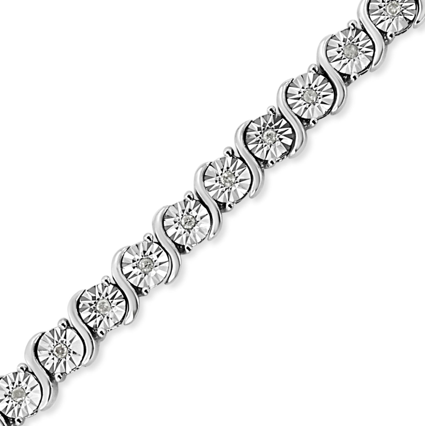 Close-up angled view of a white metal bracelet featuring round white gemstones in miracle settings arranged in a continuous pattern.