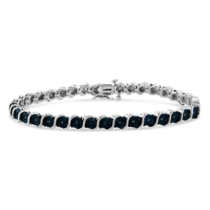 White metal bracelet with round blue gemstones in a miracle setting, shown from a front angle on a white background.