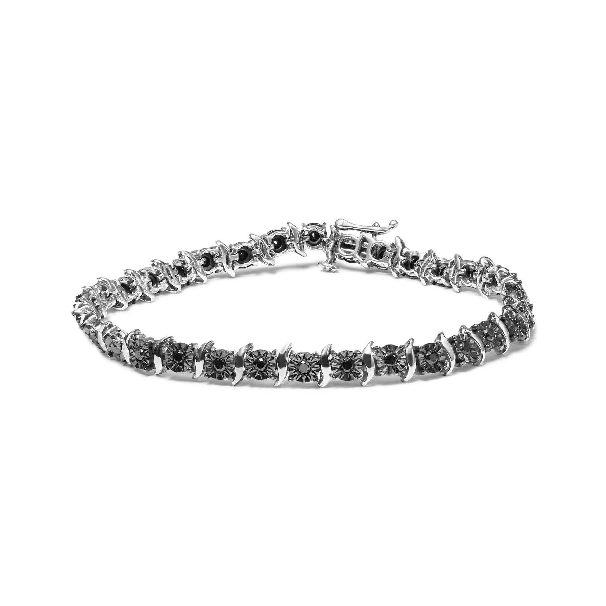 White metal bracelet with round black gemstones set in a miracle setting, shown from a slightly elevated front angle.
