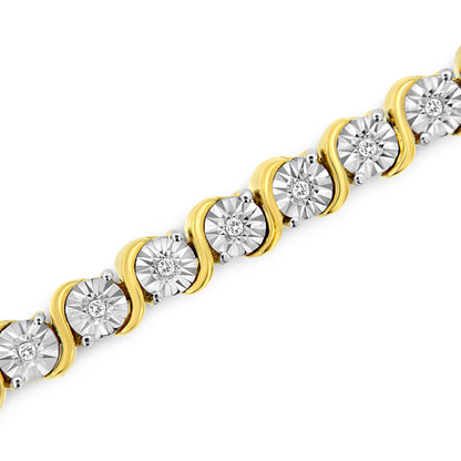 Diagonal close-up of a yellow metal bracelet featuring round white gemstones with a miracle setting.