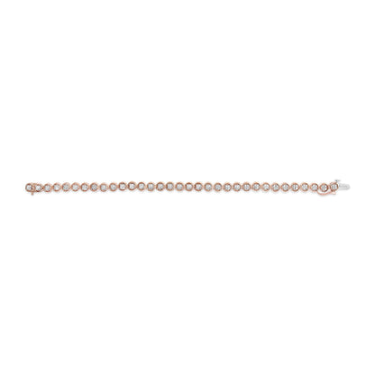 Rose metal bracelet with round white gemstones in prong settings, shown in a flat lay from a top-down angle.