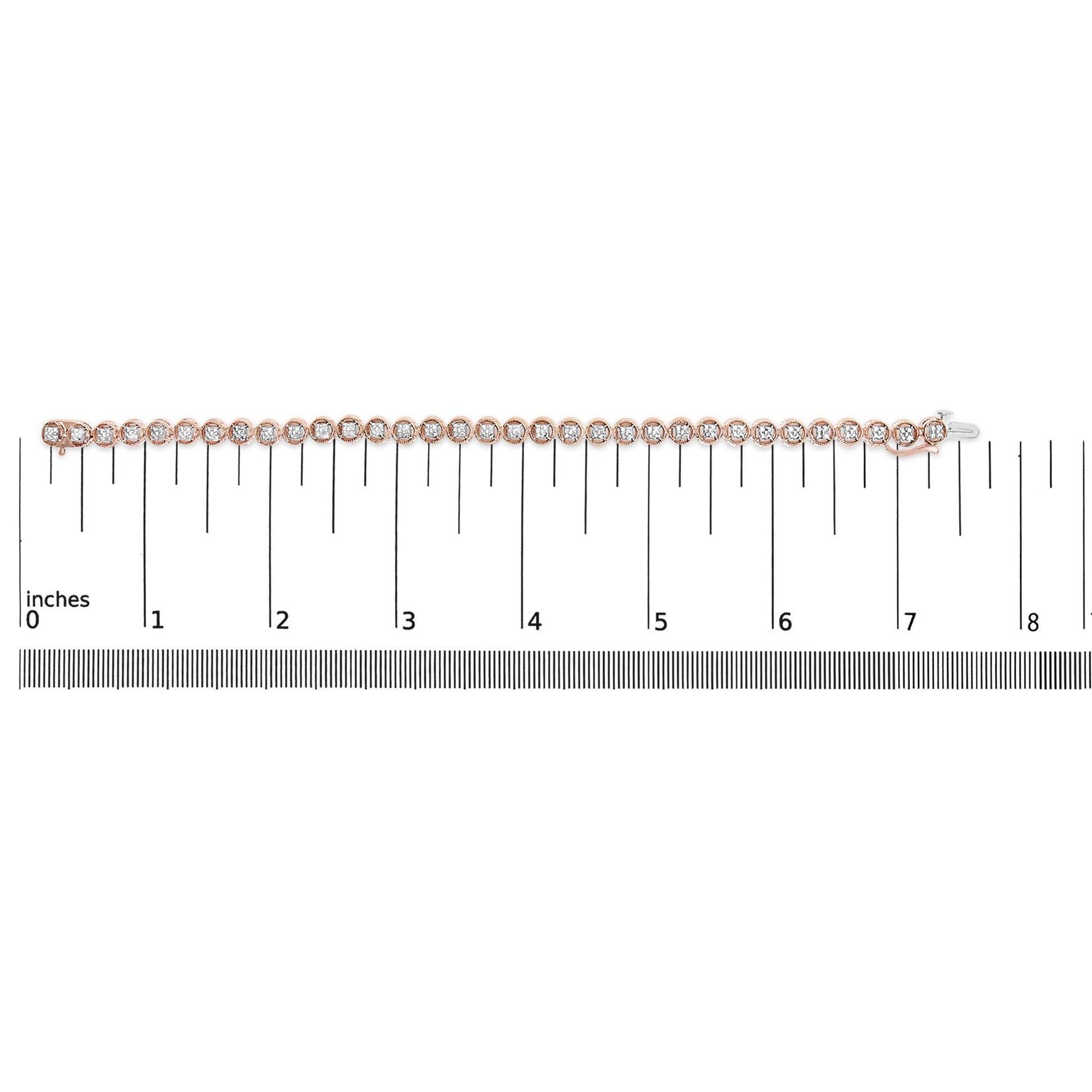 Top-down view of a rose-colored bracelet with round white gemstones in prong settings, placed on a ruler for size reference.