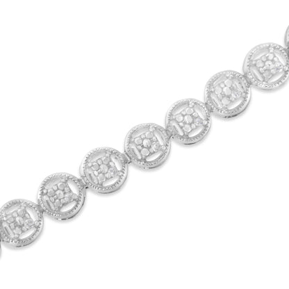 Close-up diagonal shot of a white metal bracelet featuring circular links with round white gemstones in prong settings.
