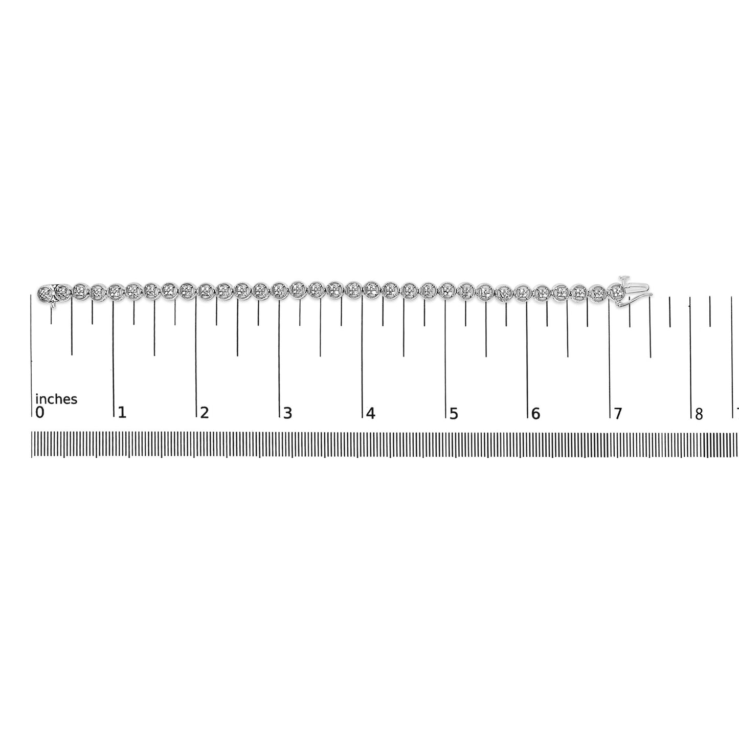 White metal bracelet with round white gemstones in prong settings, displayed flat on a ruler for size reference, shot from above.