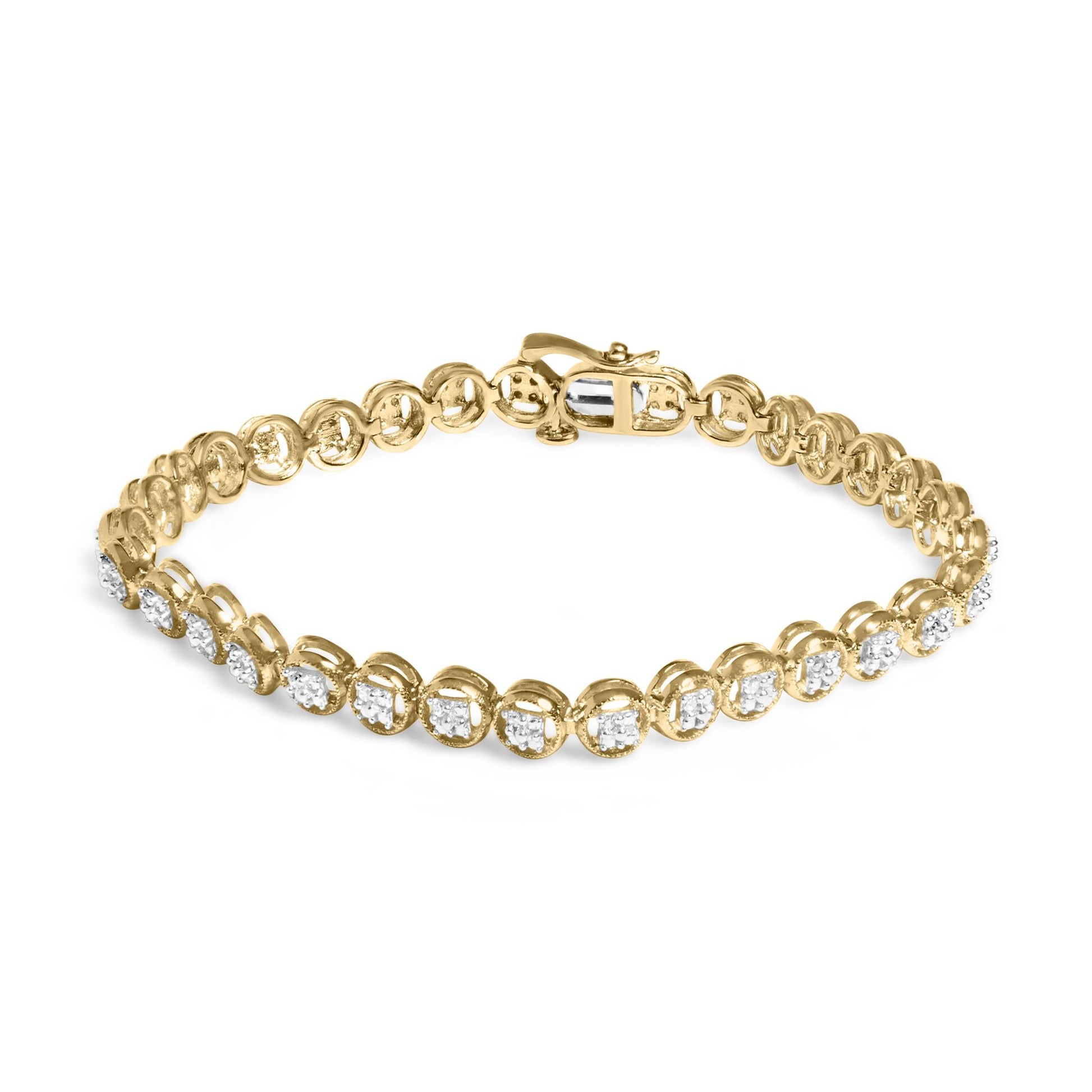 Yellow metal bracelet with prong-set round white gemstones, shown at a slight overhead angle.