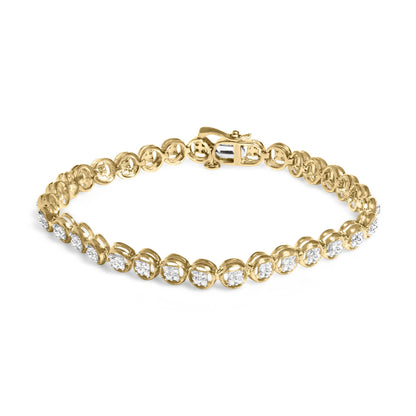 Yellow metal bracelet with prong-set round white gemstones, shown at a slight overhead angle.