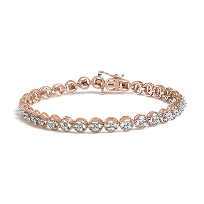Rose metal bracelet with round white gemstones in prong settings, shown from a front angle.