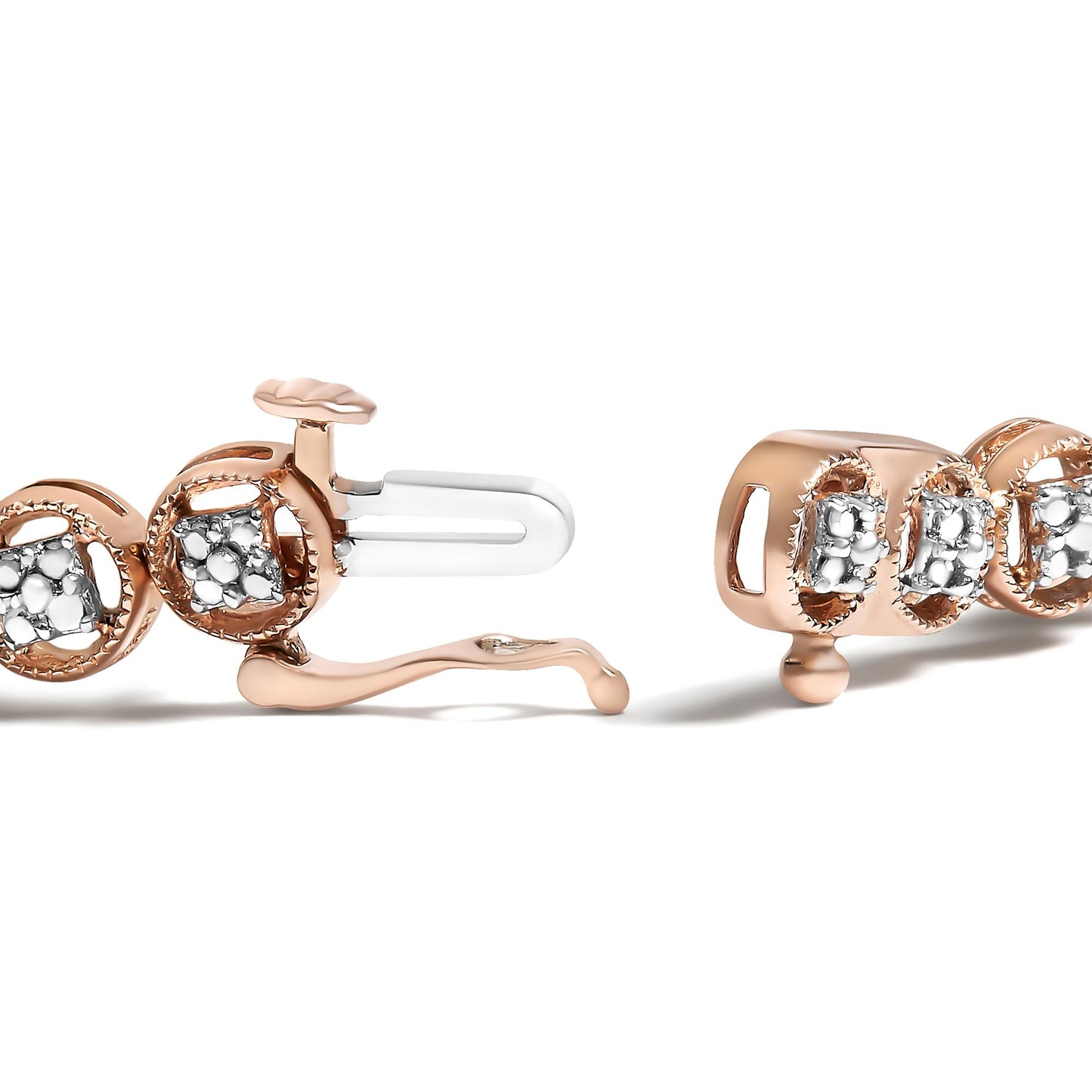 Close-up side angle of an open rose-colored bracelet with round white gemstones in prong settings.