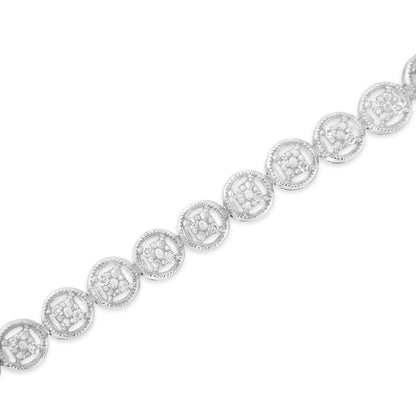 White metal bracelet with round white gemstones in prong settings within circular links, shown in a diagonal close-up angle.