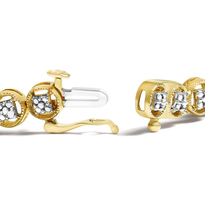 Close-up side angle of yellow metal bracelet with round white gemstones in prong setting, showing the clasp mechanism.