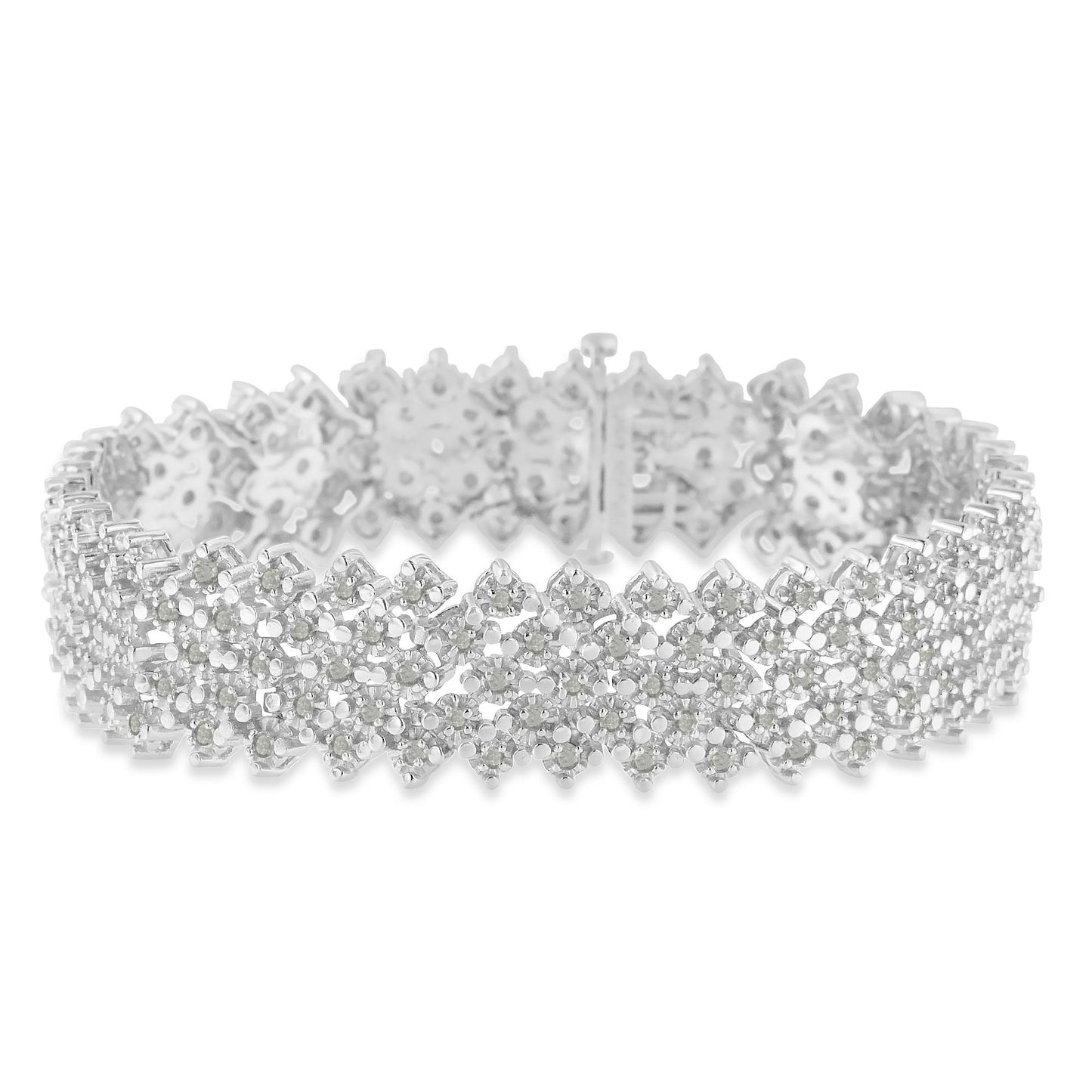 Close-up view of a white metal bracelet with round white gemstones in prong settings, arranged in a floral pattern.