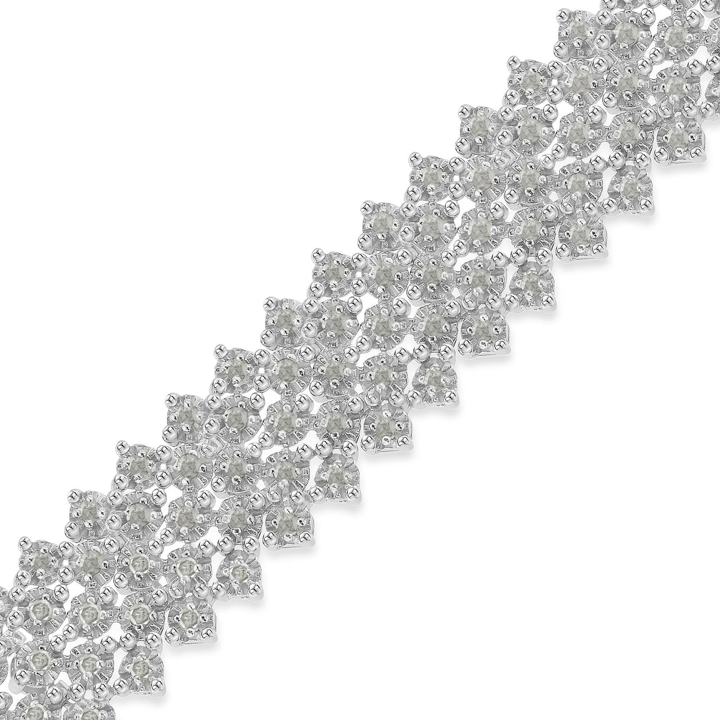 Close-up of a white metal bracelet with round white gemstones in prong settings, shot at an angle.