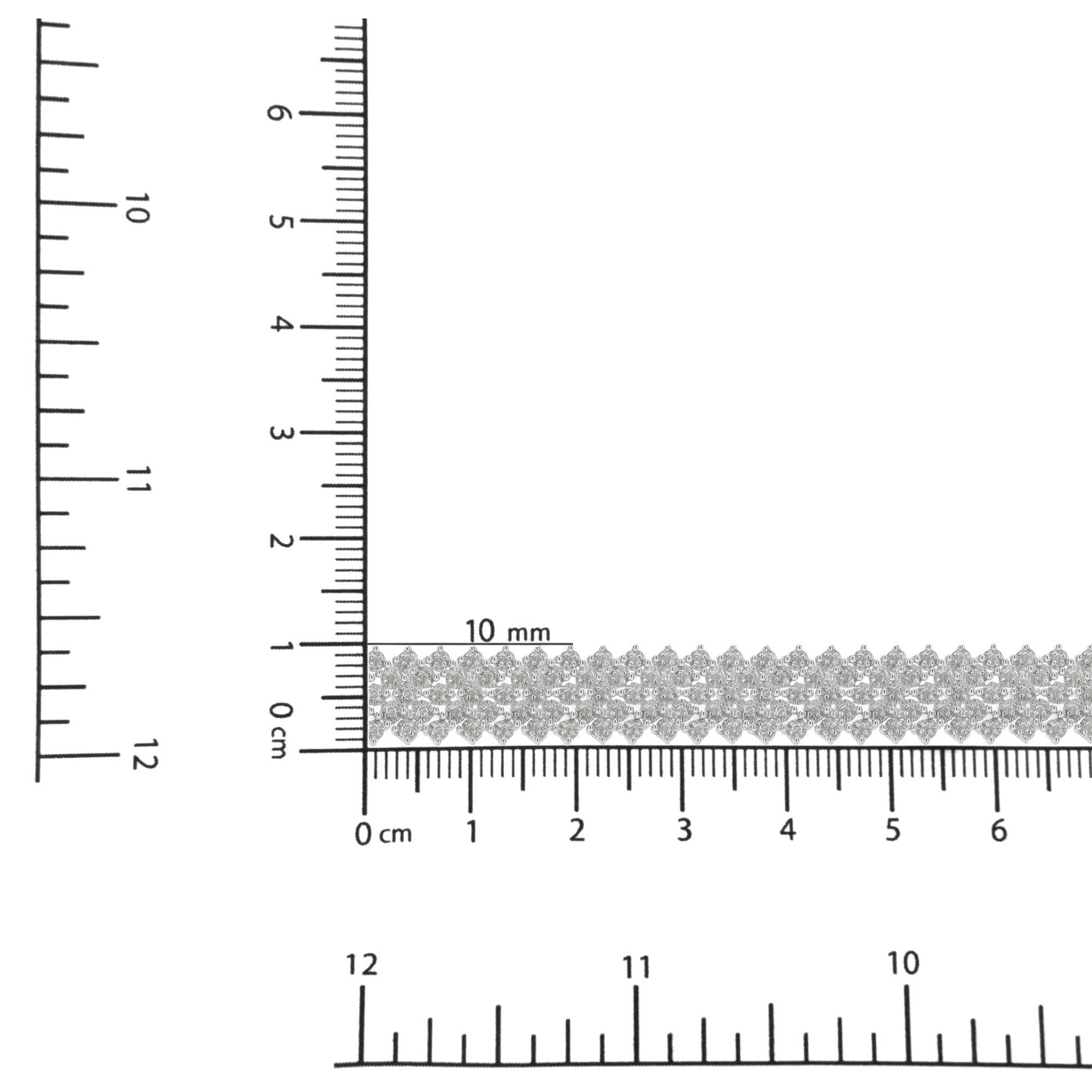 Close-up shot of a white bracelet with multiple small round white gemstones in prong settings, displayed on rulers for size reference.