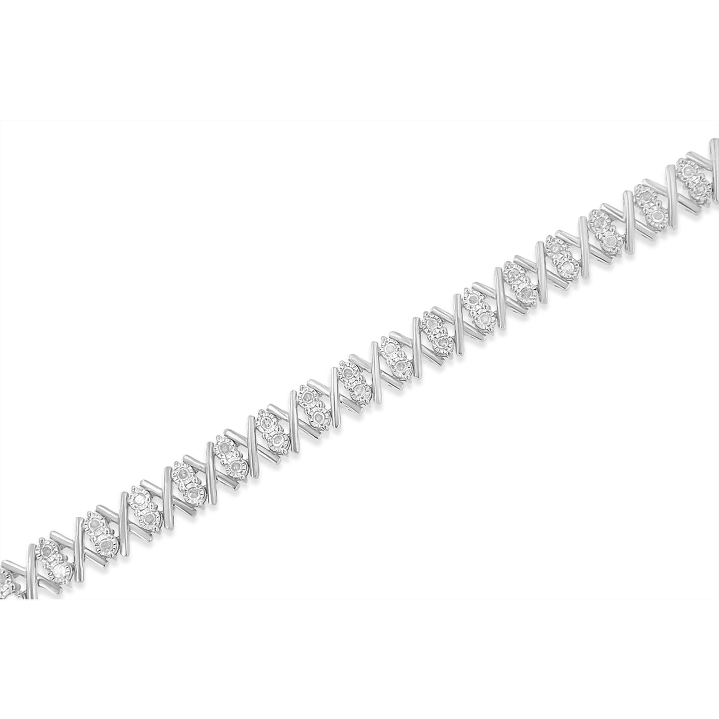 Close-up diagonal shot of a white metal bracelet with alternating X-shaped links and clusters of round white gemstones in miracle settings.