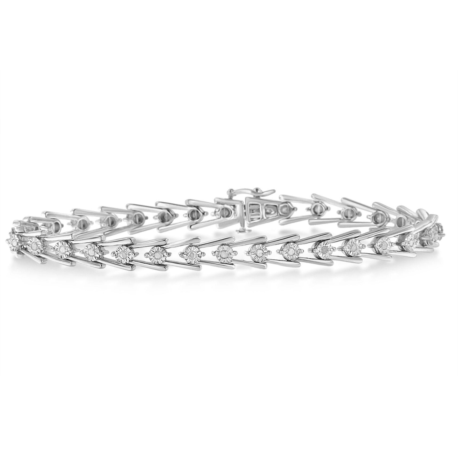 White metal bracelet with round white gemstones in a miracle setting, shown from a side angle.