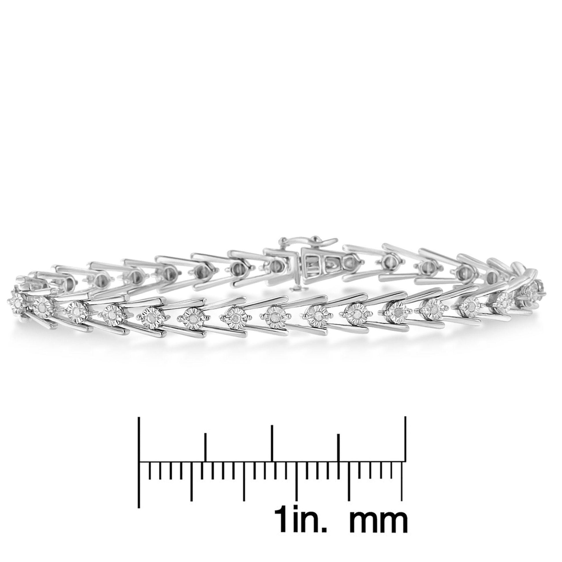 White metal bracelet with round white gemstones in miracle setting, displayed on scale, side angle.