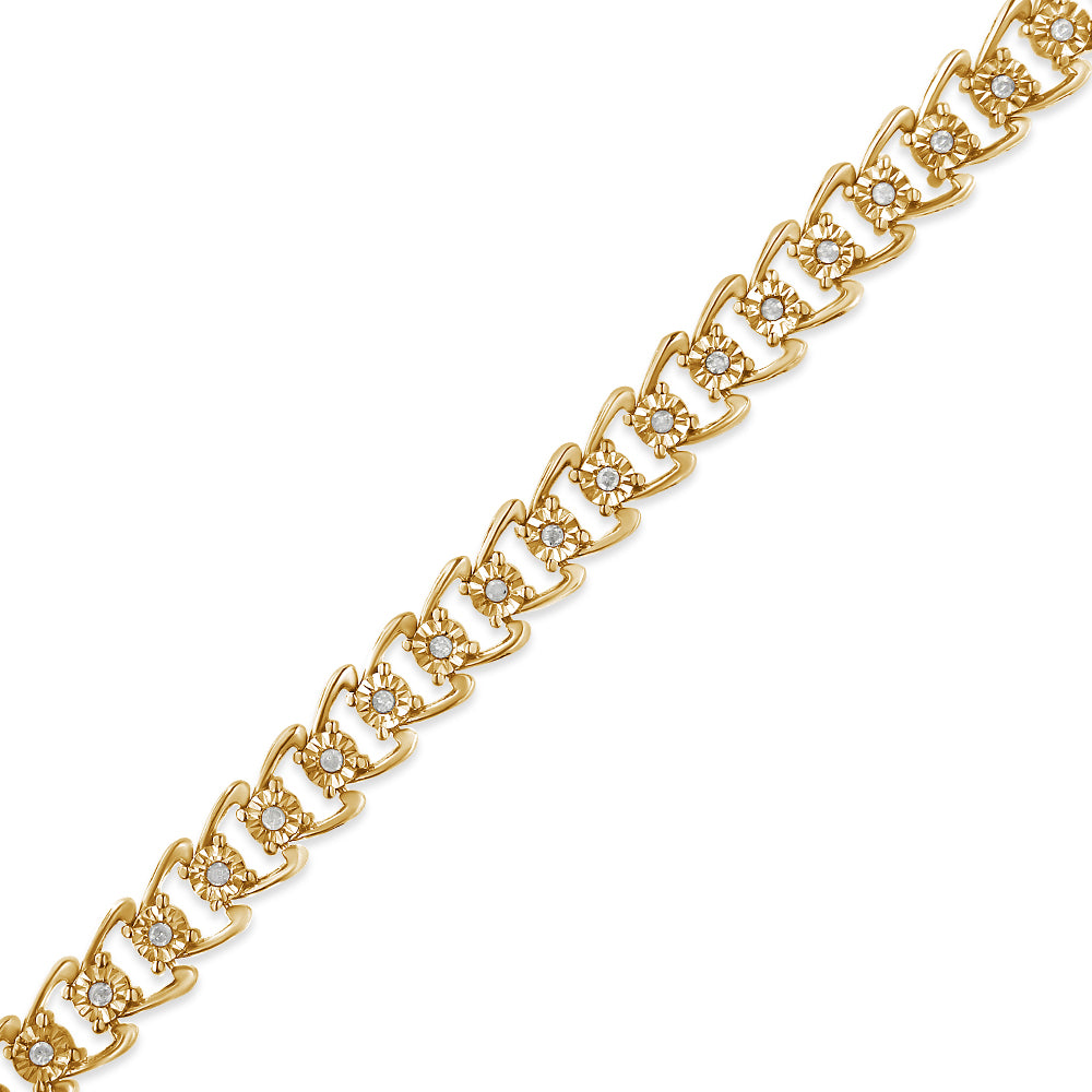 Diagonal close-up of a yellow bracelet with linked sections, each featuring a round white gemstone in a miracle setting.