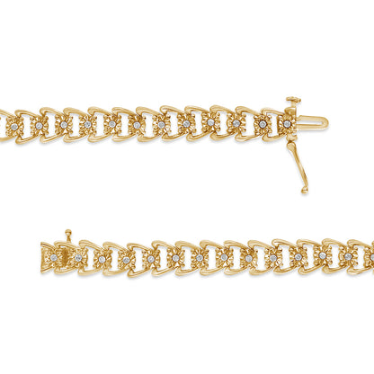 Close-up front view of two yellow metal bracelets with round white gemstones in a miracle setting.