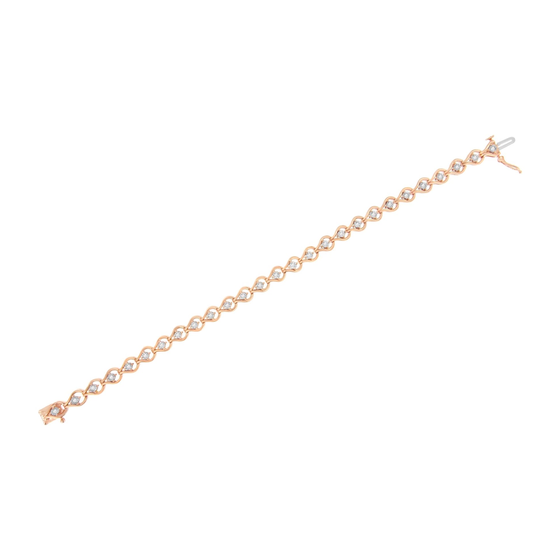 Rose-colored bracelet with round white gemstones in a miracle setting, shown in a flat lay angled view.