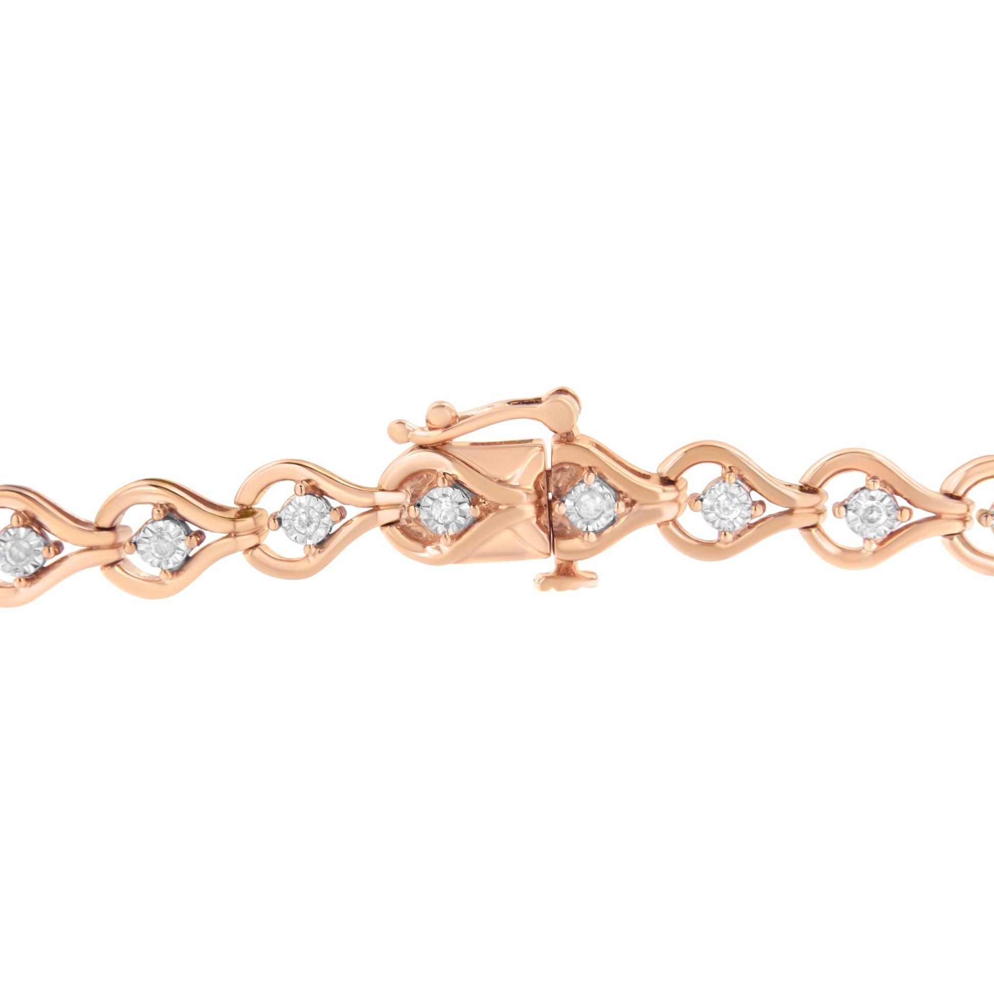 Close-up front view of a rose-colored bracelet with linked wave-shaped sections each set with a round white gemstone, shown on a white background.