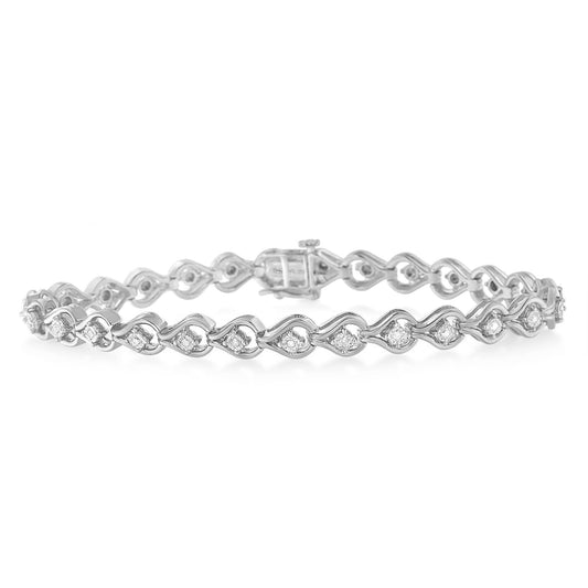 White metal bracelet with round white gemstones in miracle settings, shown in side angle.