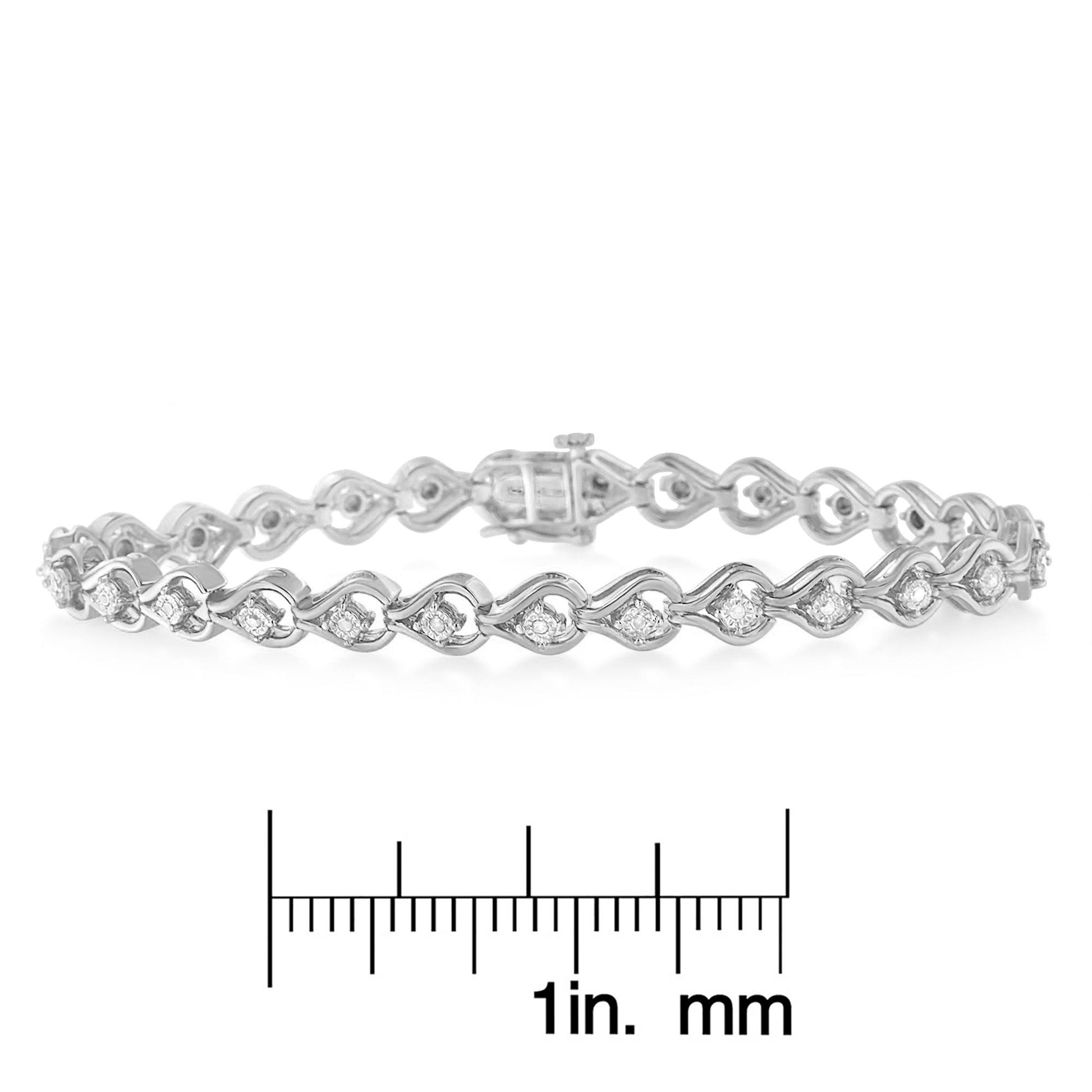 White metal bracelet with round white gemstones in a miracle setting, shown from a side angle, placed above a ruler for size reference.