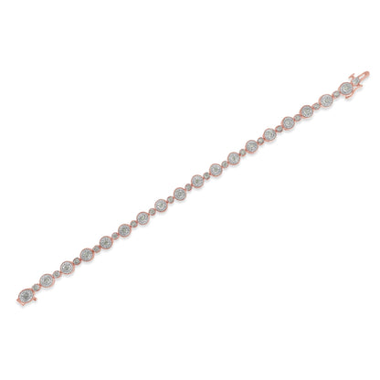 Rose-colored bracelet with round white gemstones in a miracle setting, shown flat at a diagonal angle.