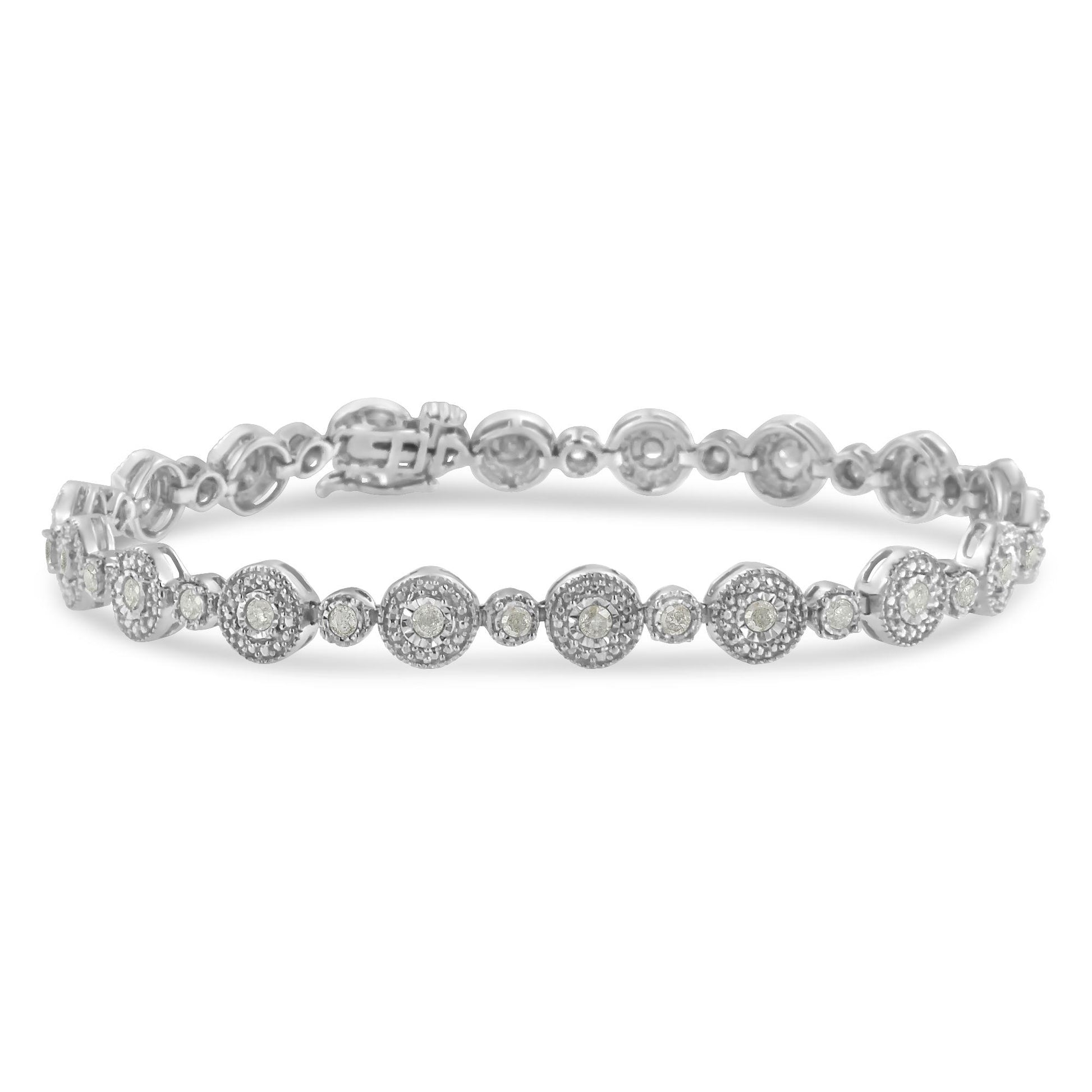 White metal bracelet with alternating small and larger round settings, each featuring white gemstones, shot at a slight top-front angle.