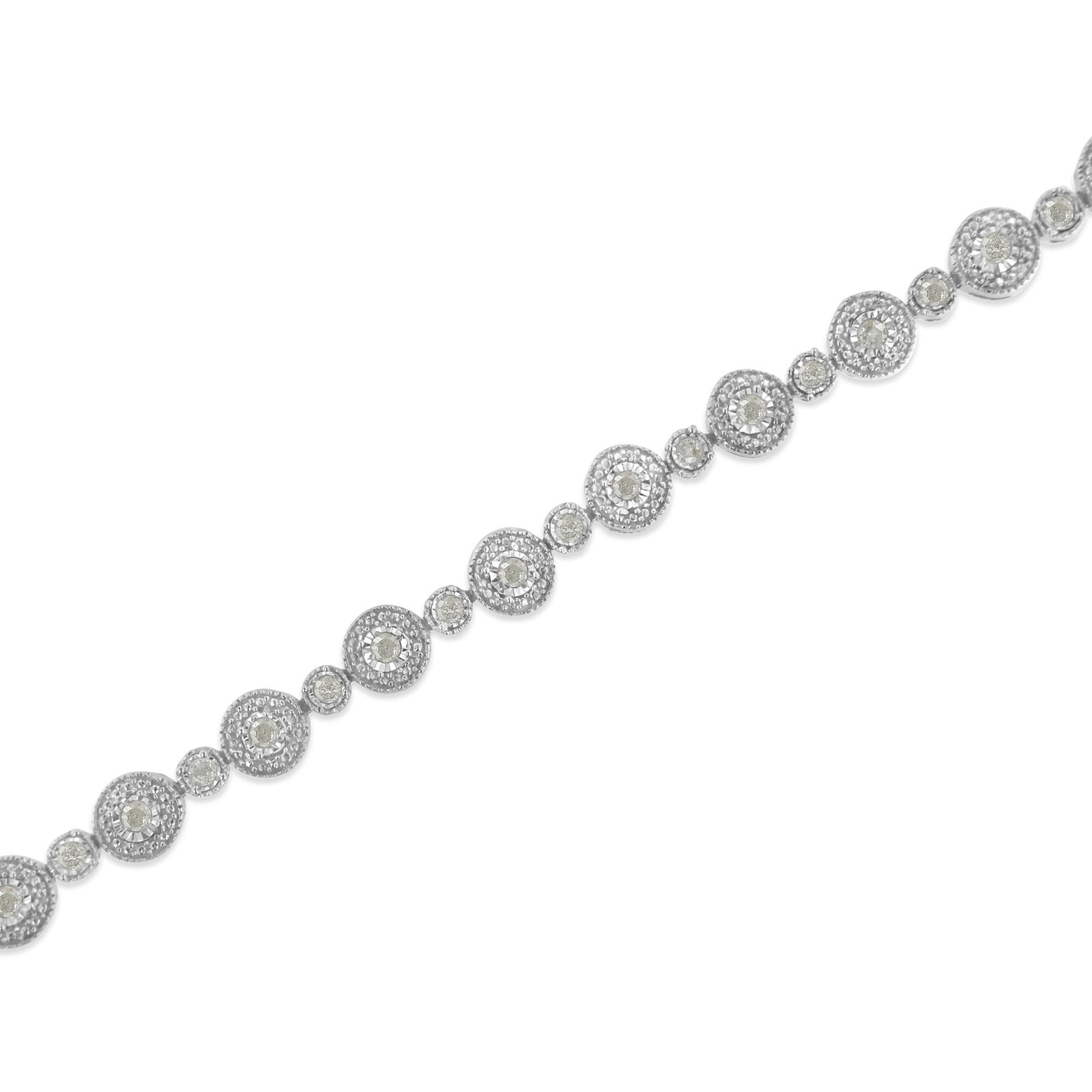 Diagonal close-up of a white metal bracelet featuring round white gemstones in a miracle setting with alternating larger and smaller circular links.